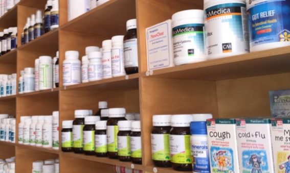 nutritional herbal supplements on a wooden shelf