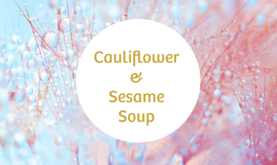 A round text box with the words cauliflower and sesame soup on a light blue and pink background